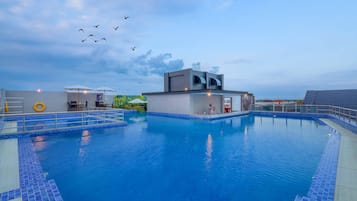 Outdoor pool, pool umbrellas, pool loungers