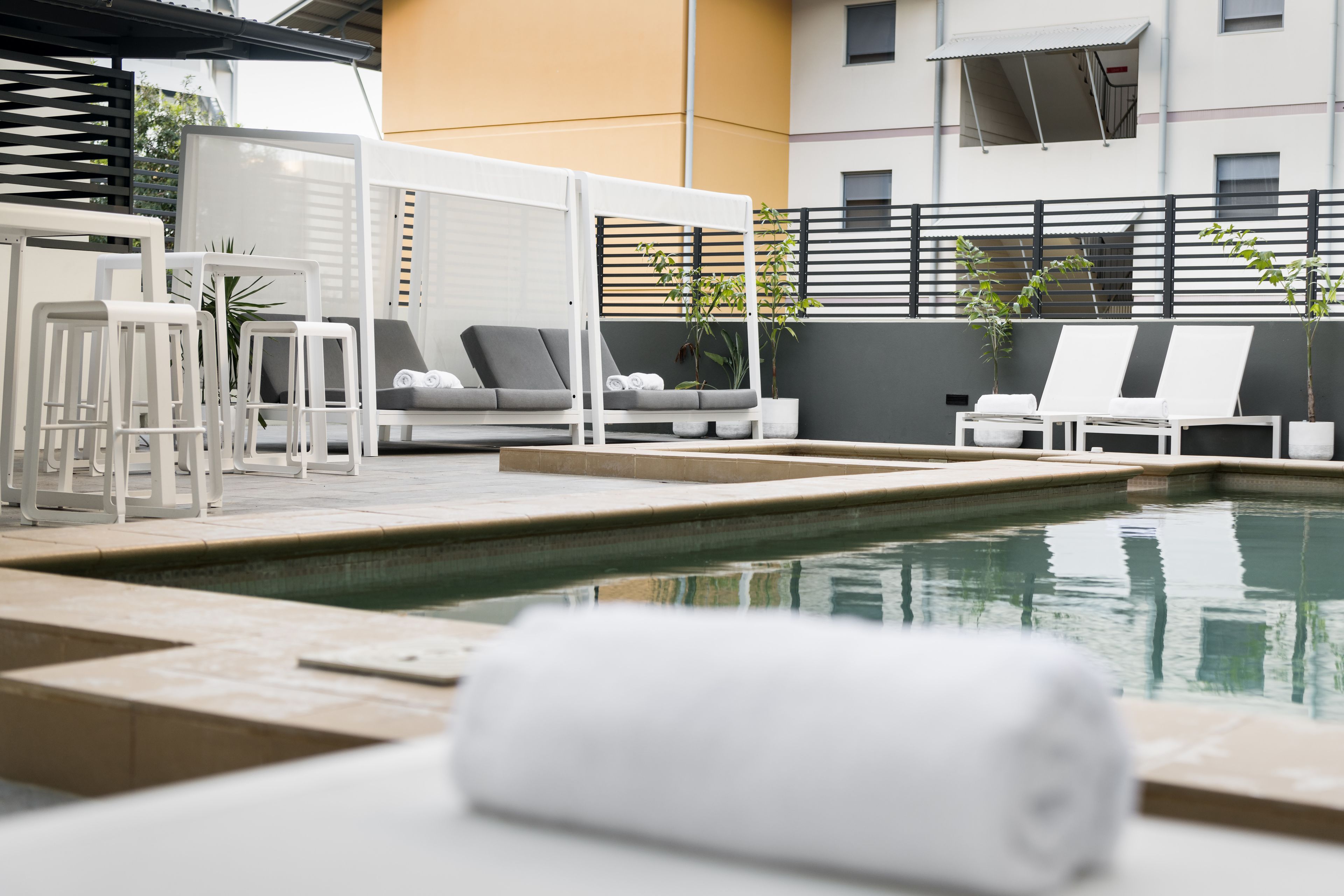 outdoor pool, pool umbrellas, pool loungers