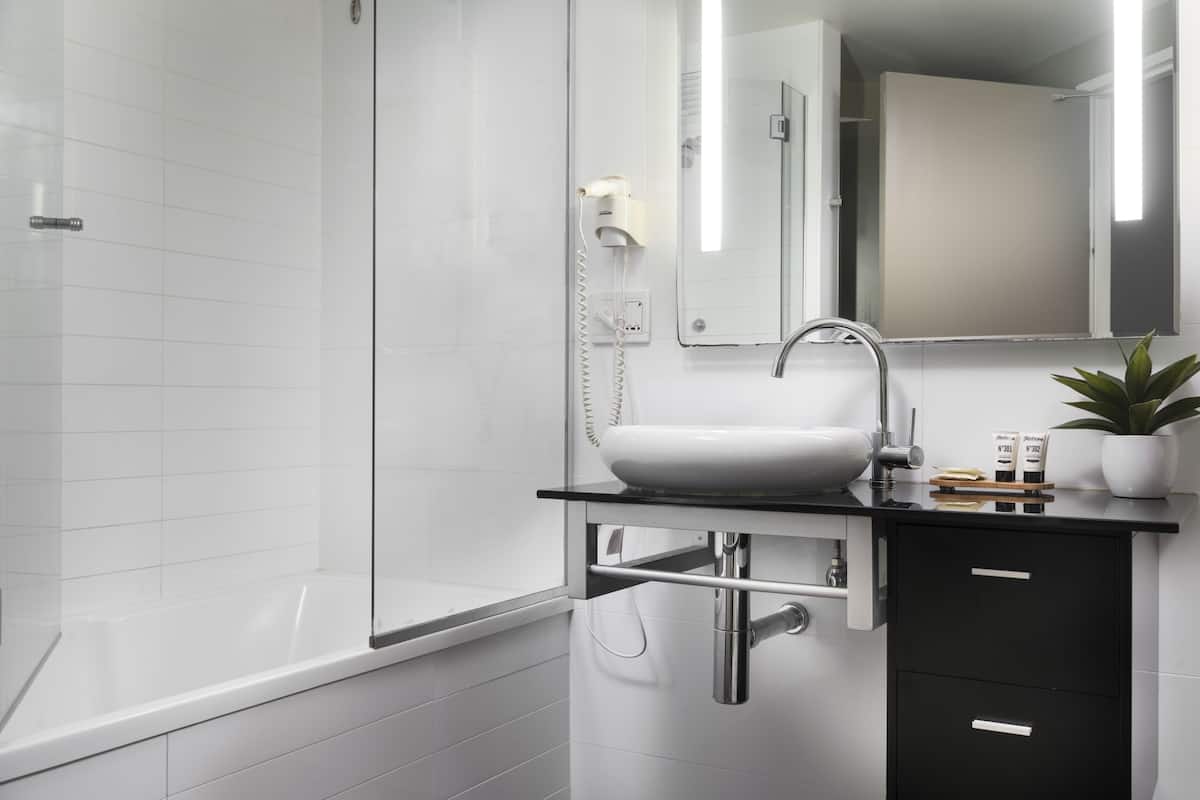 shower, designer toiletries, hair dryer, towels