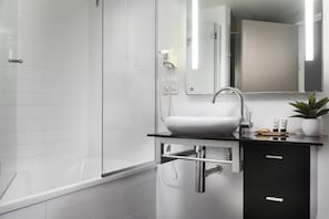 Shower, designer toiletries, hair dryer, towels