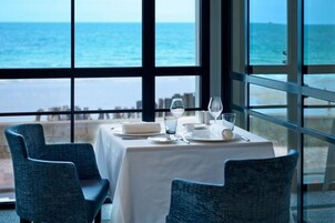 Breakfast, lunch, dinner served; beach views