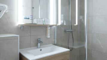 Shower, free toiletries, hair dryer, towels