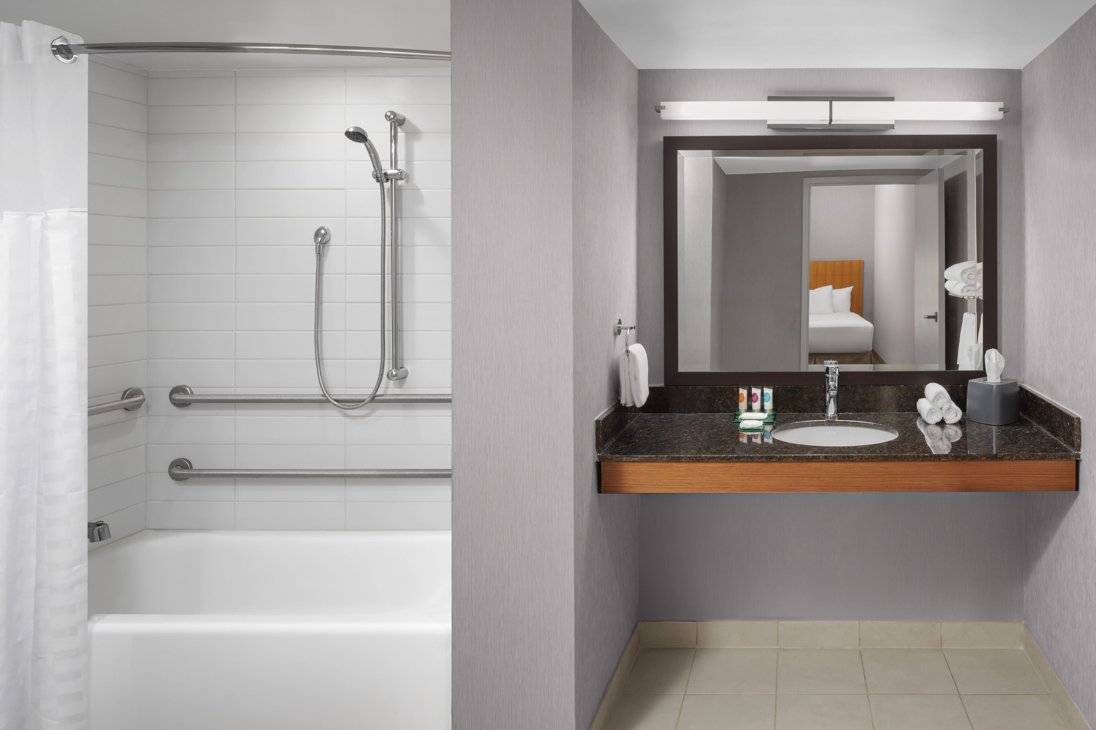 designer toiletries, hair dryer, towels