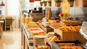 A buffet with various food items and beverages, including fruits, vegetables, and pastries. - Arco Barcelona Hotel (Barcelona)