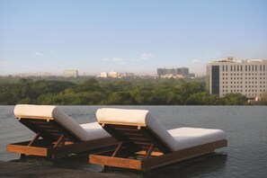 Outdoor pool, open 6:00 AM to 9:00 PM, pool umbrellas, sun loungers - Park Hyatt Chennai (Chennai)