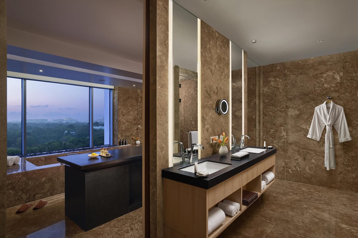 combined shower/bathtub, deep-soaking bathtub, rainfall showerhead