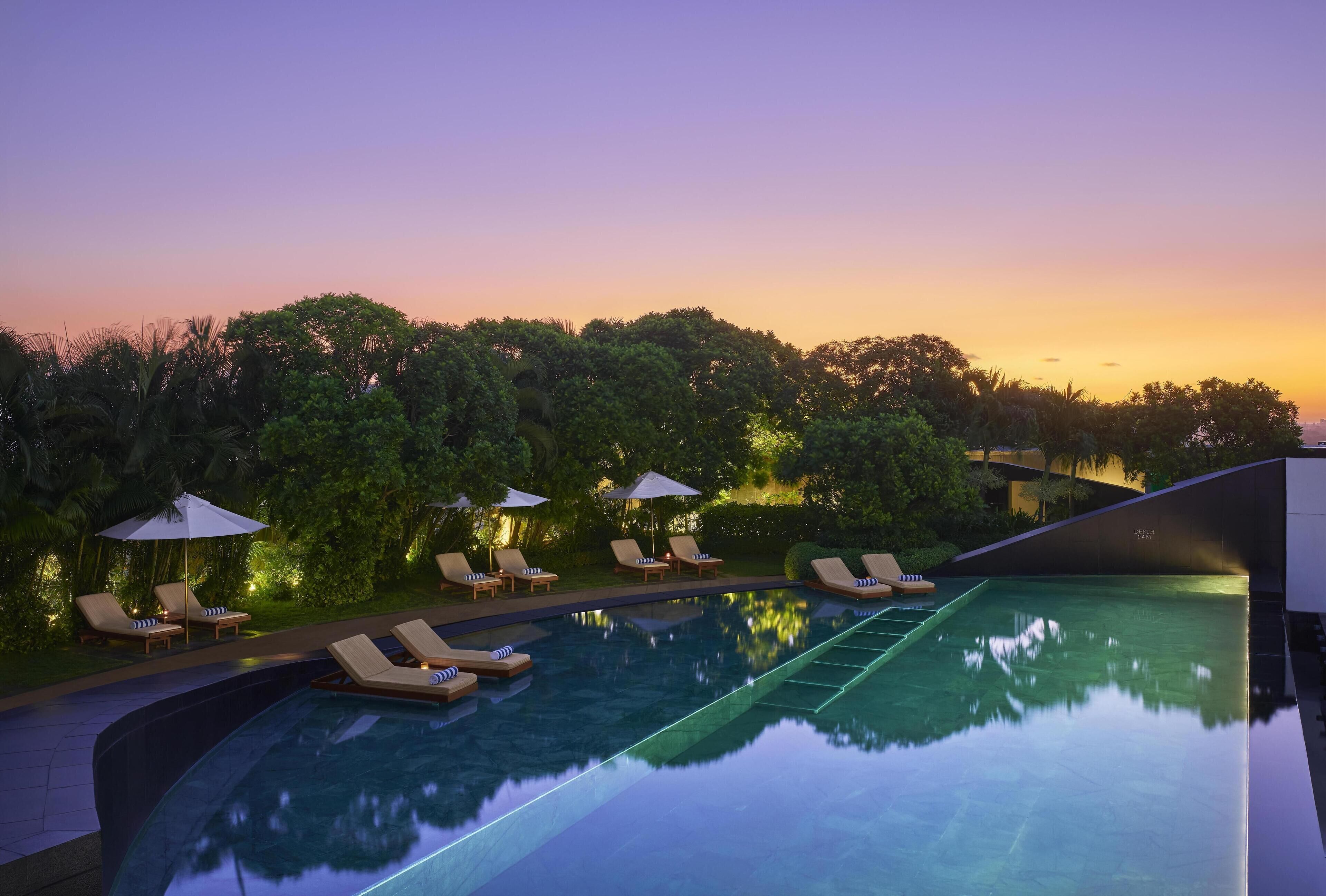 Outdoor pool, open 6:00 AM to 9:00 PM, pool umbrellas, pool loungers