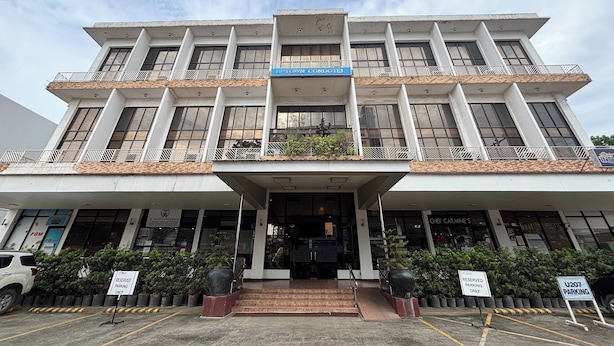 A multi-story building with a sign for 'Luptown Condomotel' and 'U207 Parking' visible. - Noorway Hotel and Residences (Cagayan de Oro)