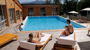 Indoor pool, seasonal outdoor pool, pool umbrellas, pool loungers