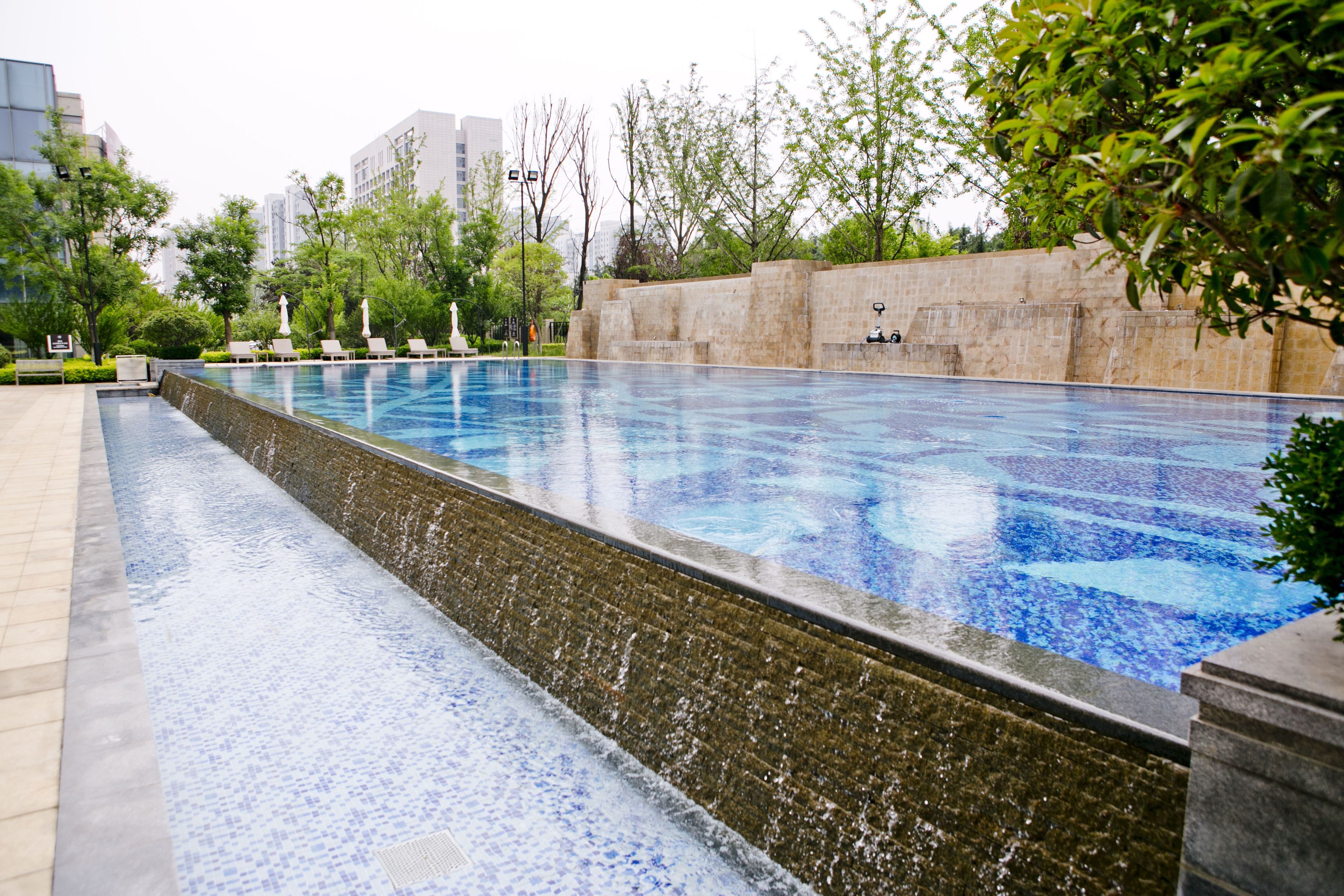 indoor pool, seasonal outdoor pool, pool umbrellas, pool loungers