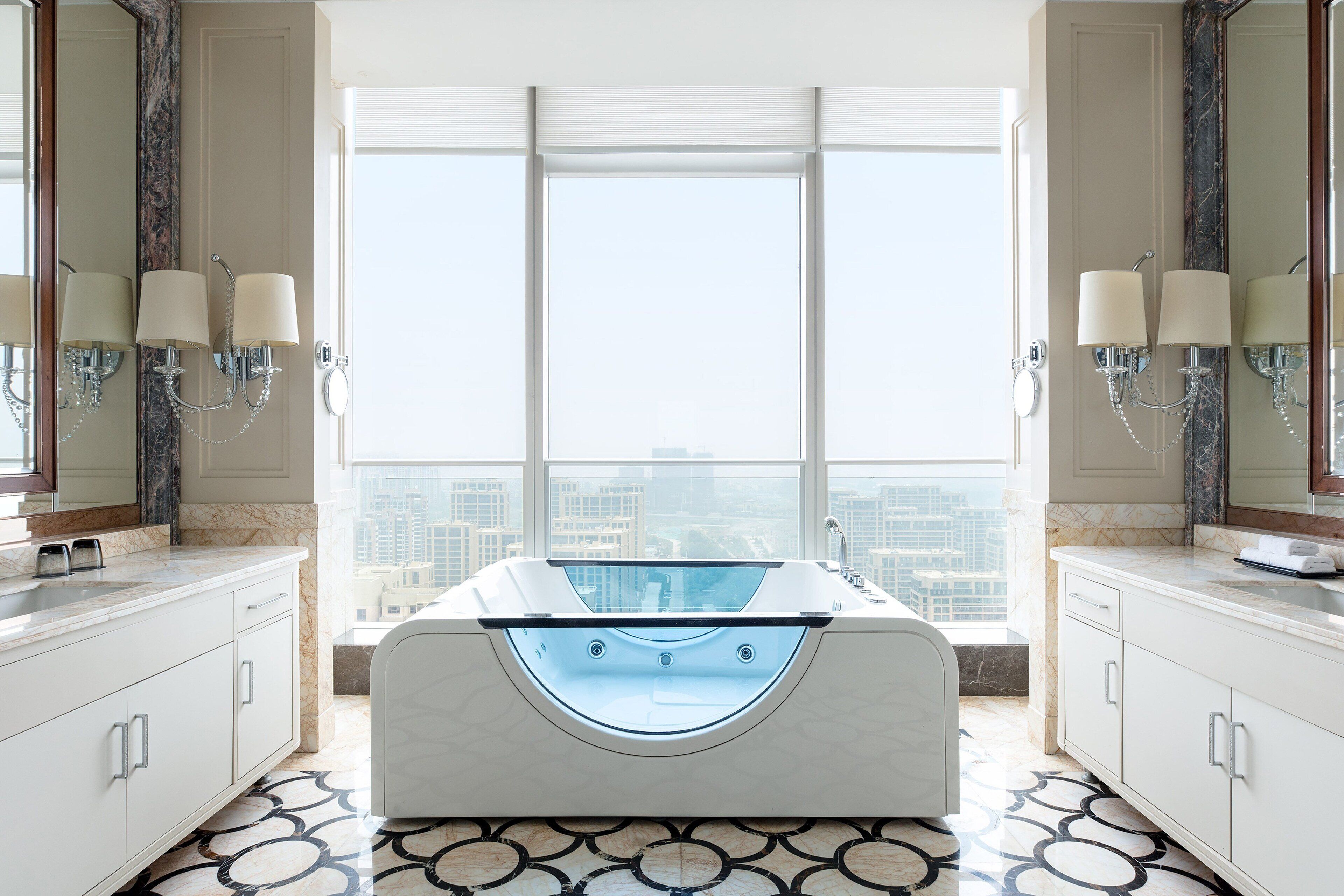 deep-soaking bathtub, rainfall showerhead, free toiletries, hair dryer