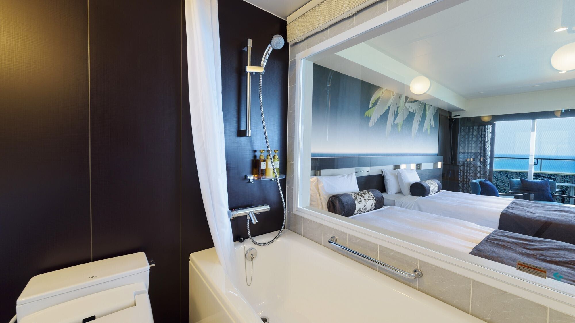 premium twin room, ocean view | bathroom | separate bathtub and shower, free toiletries, hair dryer, slippers