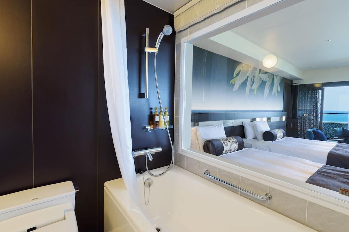 premium twin room, ocean view | bathroom | separate bathtub and shower, free toiletries, hair dryer, slippers