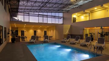 Indoor pool, open 9:00 AM to 6:00 PM, pool loungers