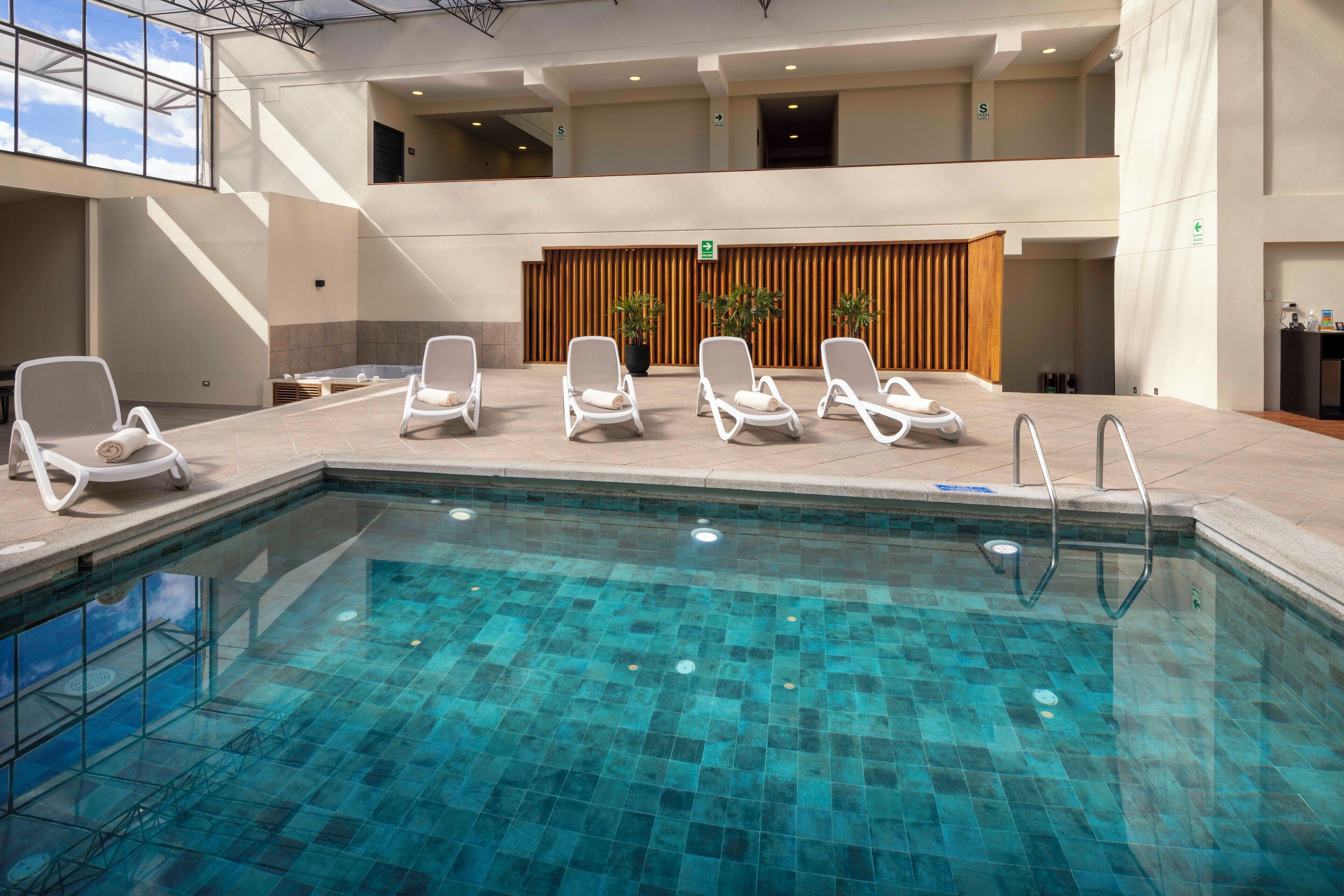 indoor pool, open 9:00 am to 6:00 pm, pool loungers