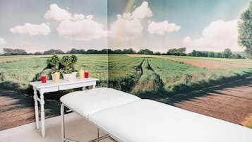 Experience serene views with a panoramic mural of a peaceful landscape, featuring a field and trees, from the comfort of this simple, functional room.