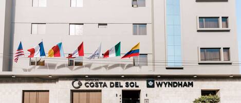 A hotel named 'Costa del Sol Wyndham' with multiple flags displayed outside.