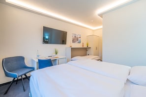 Comfort Triple Room | Living area | 80-cm TV with cable channels, foosball - Hotel Mukran (Sassnitz)