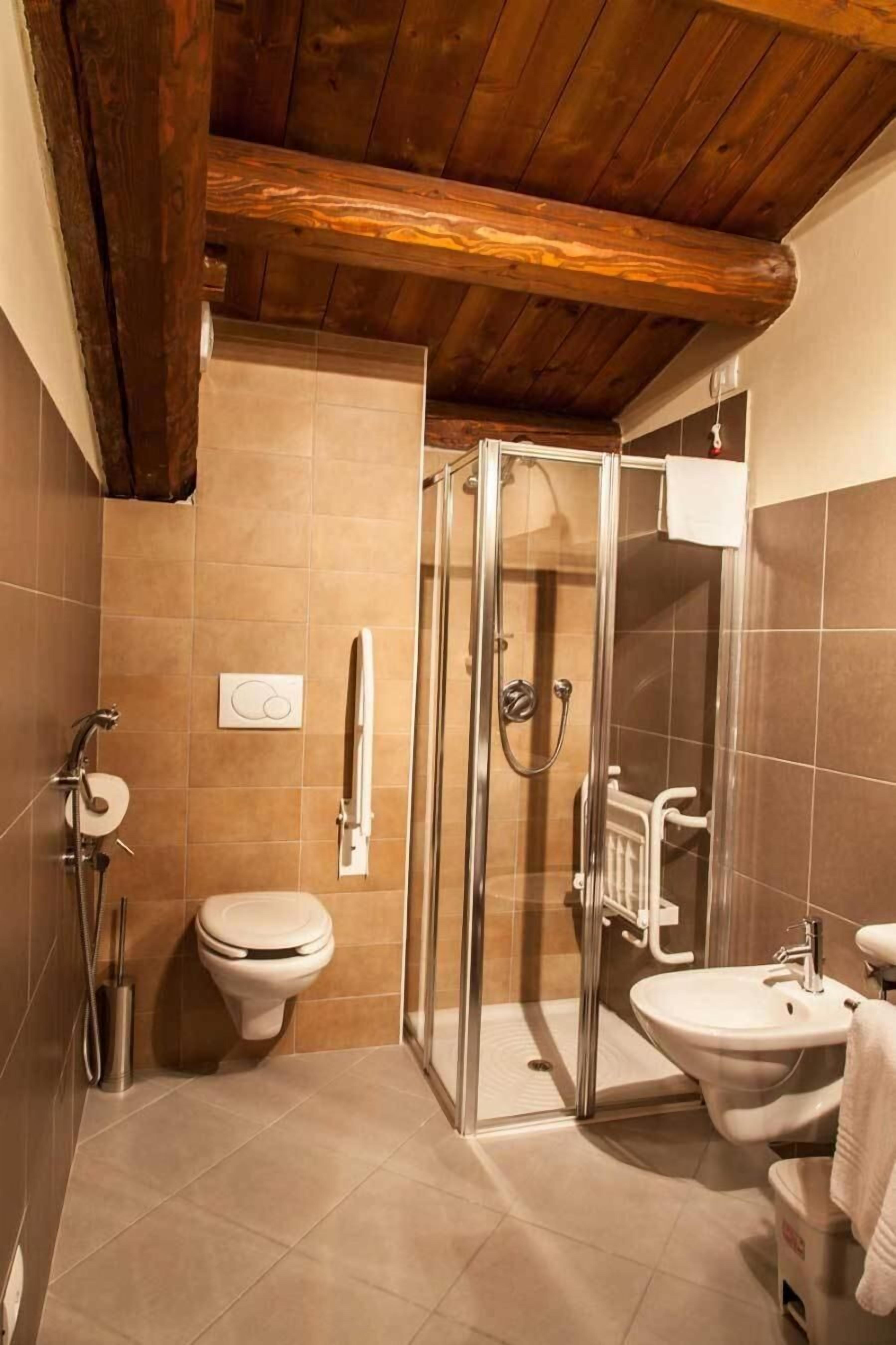 shower, hair dryer, bidet, towels