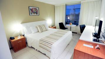 Deluxe Room, 1 Queen Bed, City View | Minibar, in-room safe, blackout drapes, iron/ironing board