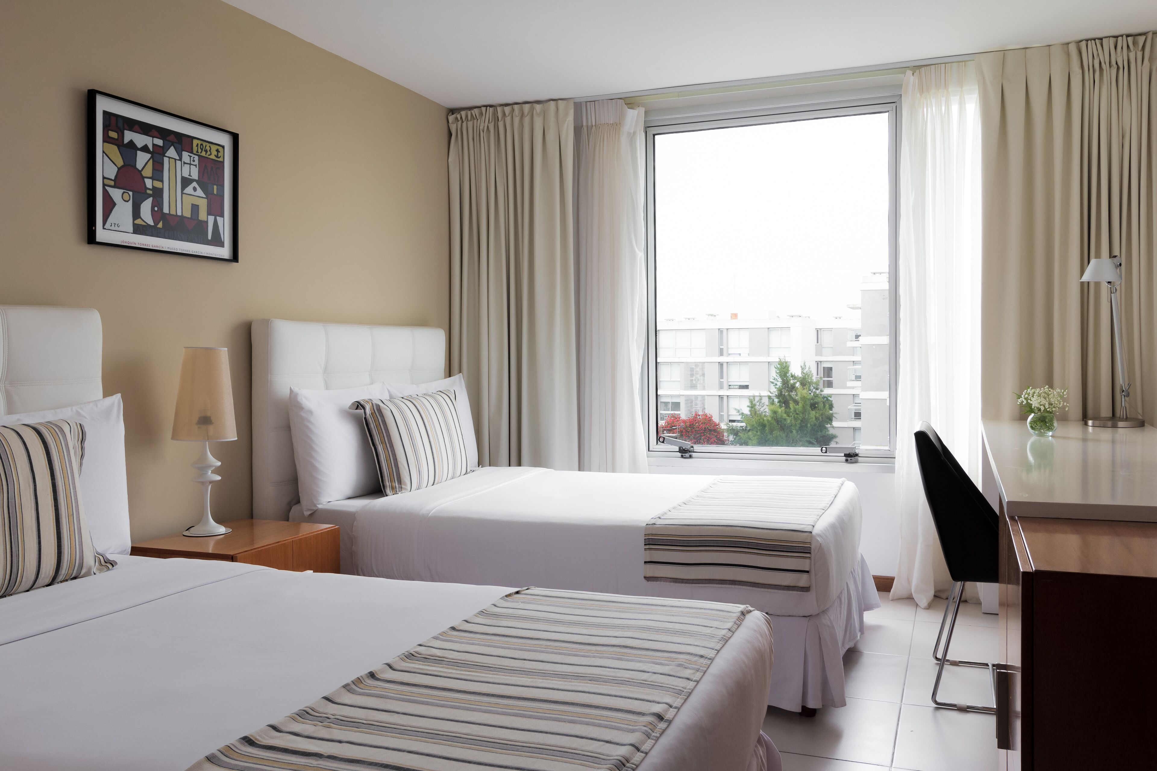 deluxe room, 2 single beds, city view | minibar, in-room safe, blackout curtains, iron/ironing board