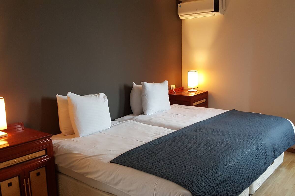Family Room | Minibar, blackout drapes, WiFi (free), individually decorated