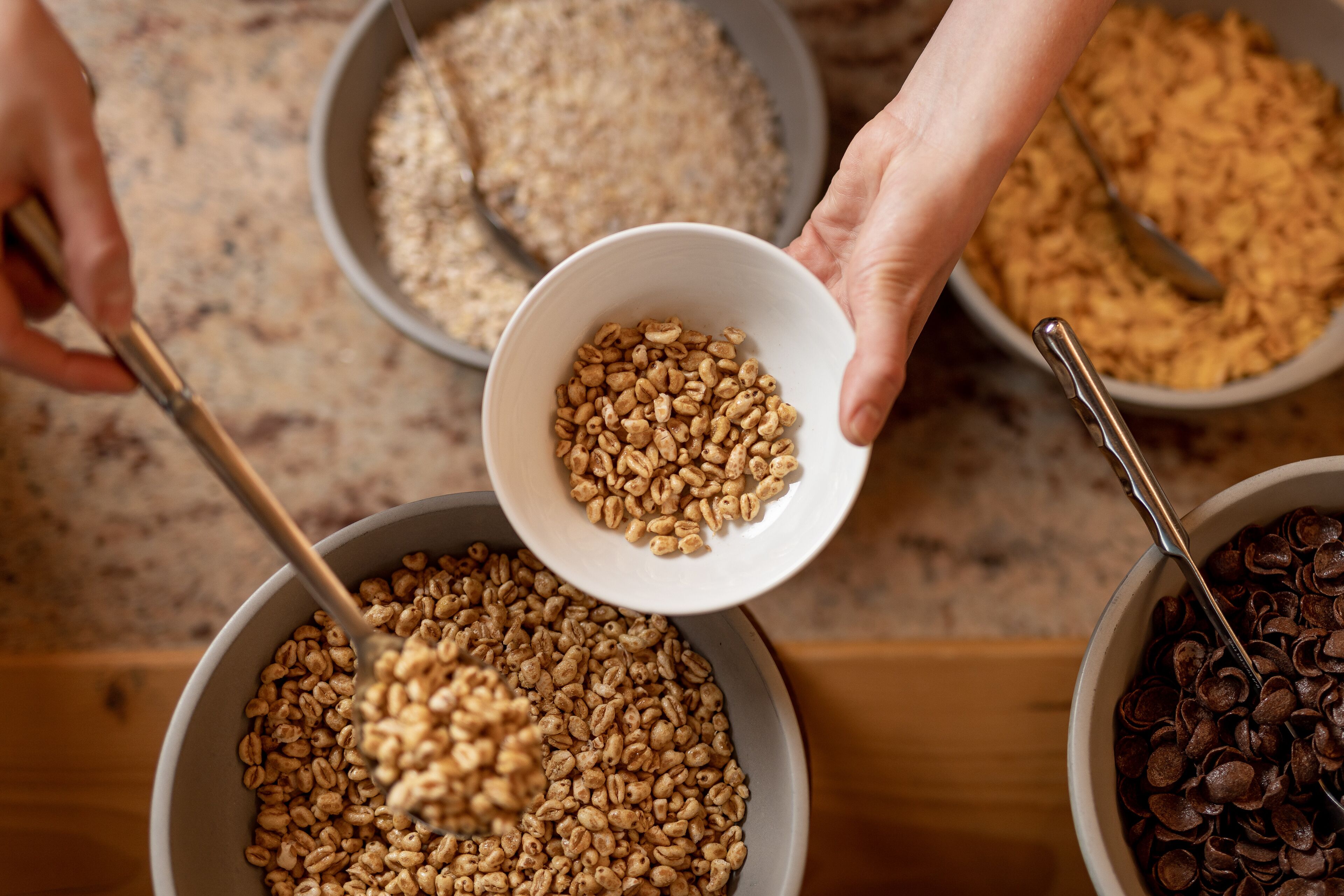 Three bowls of different grains.
