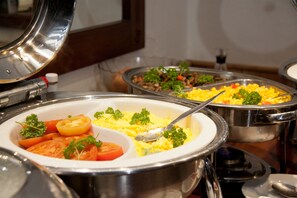 A buffet with various dishes including scrambled eggs, vegetables, and a salad. - Tzaneen Country Lodge (Tzaneen)