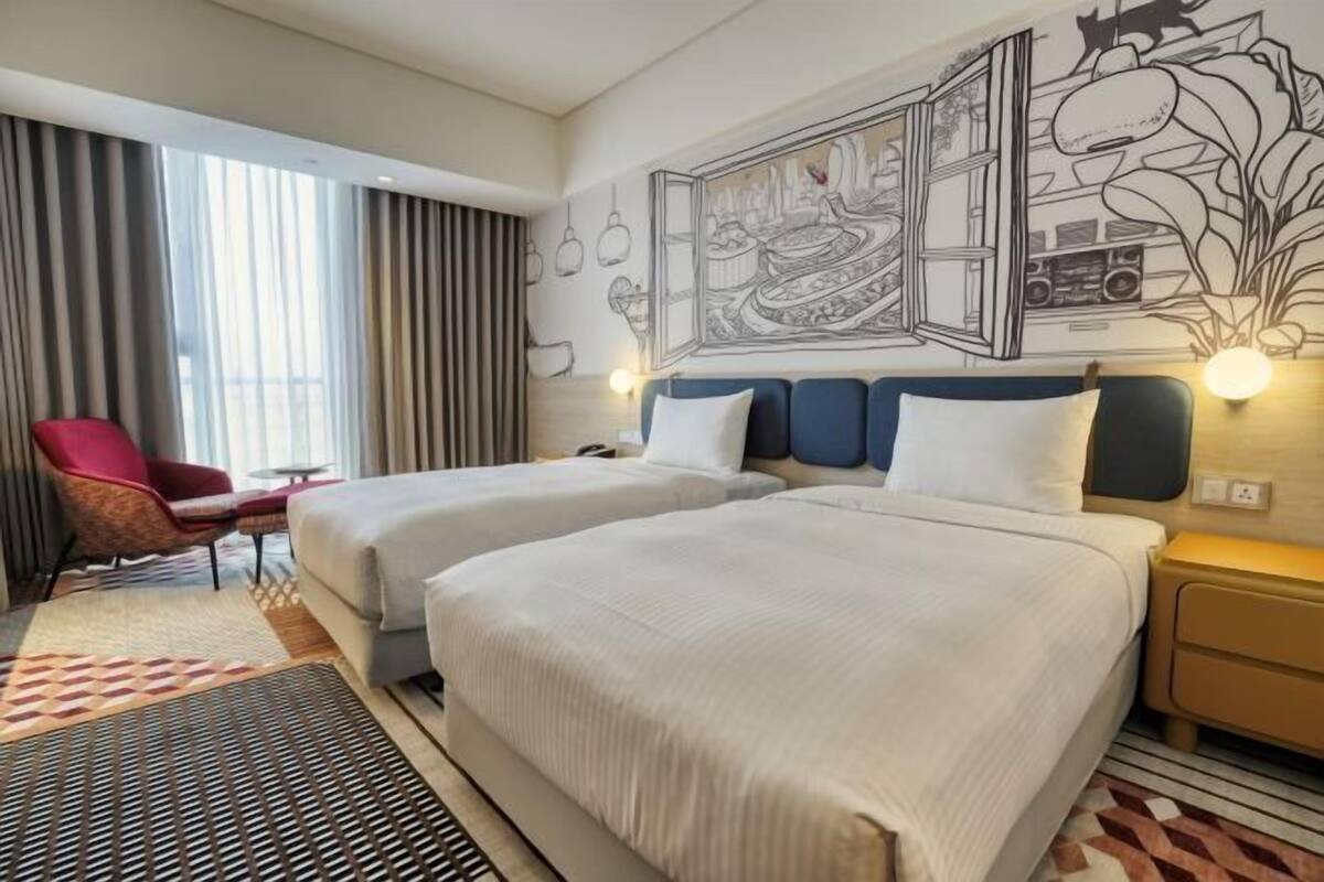 Down duvets, pillow-top beds, in-room safe, desk