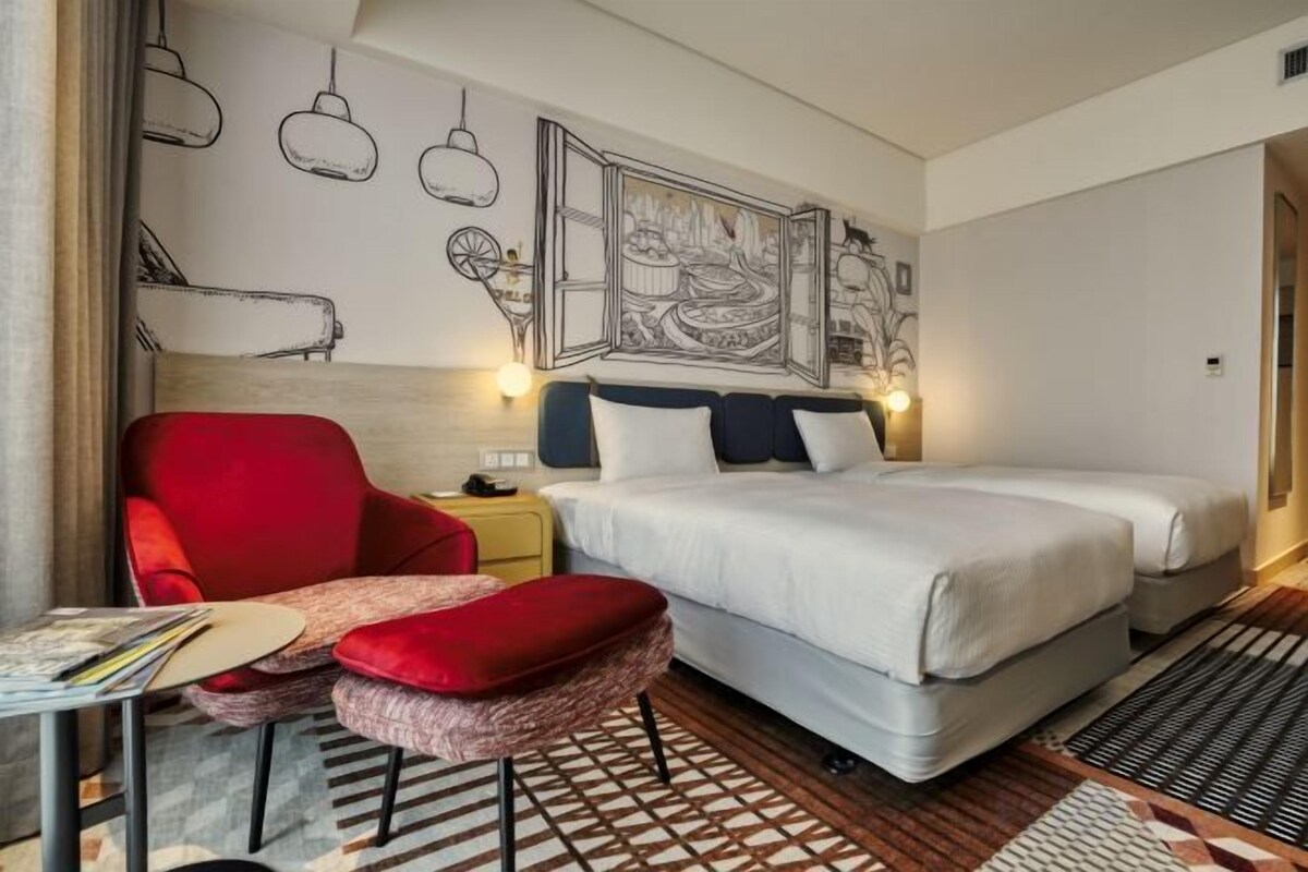 Down duvets, pillow-top beds, in-room safe, blackout curtains