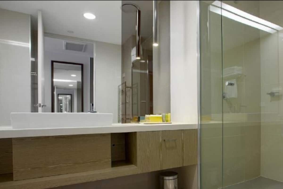 Shower, rainfall showerhead, designer toiletries, hair dryer
