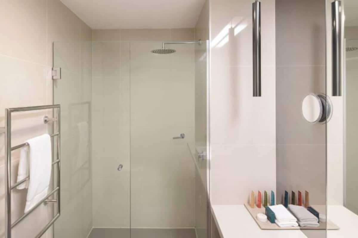 Shower, rainfall showerhead, designer toiletries, hair dryer