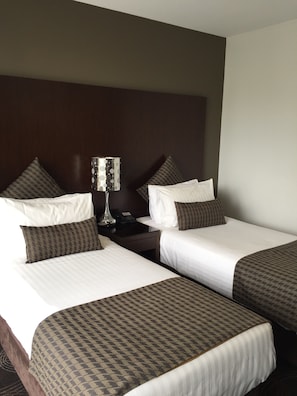 Premium bedding, pillow-top beds, in-room safe, desk