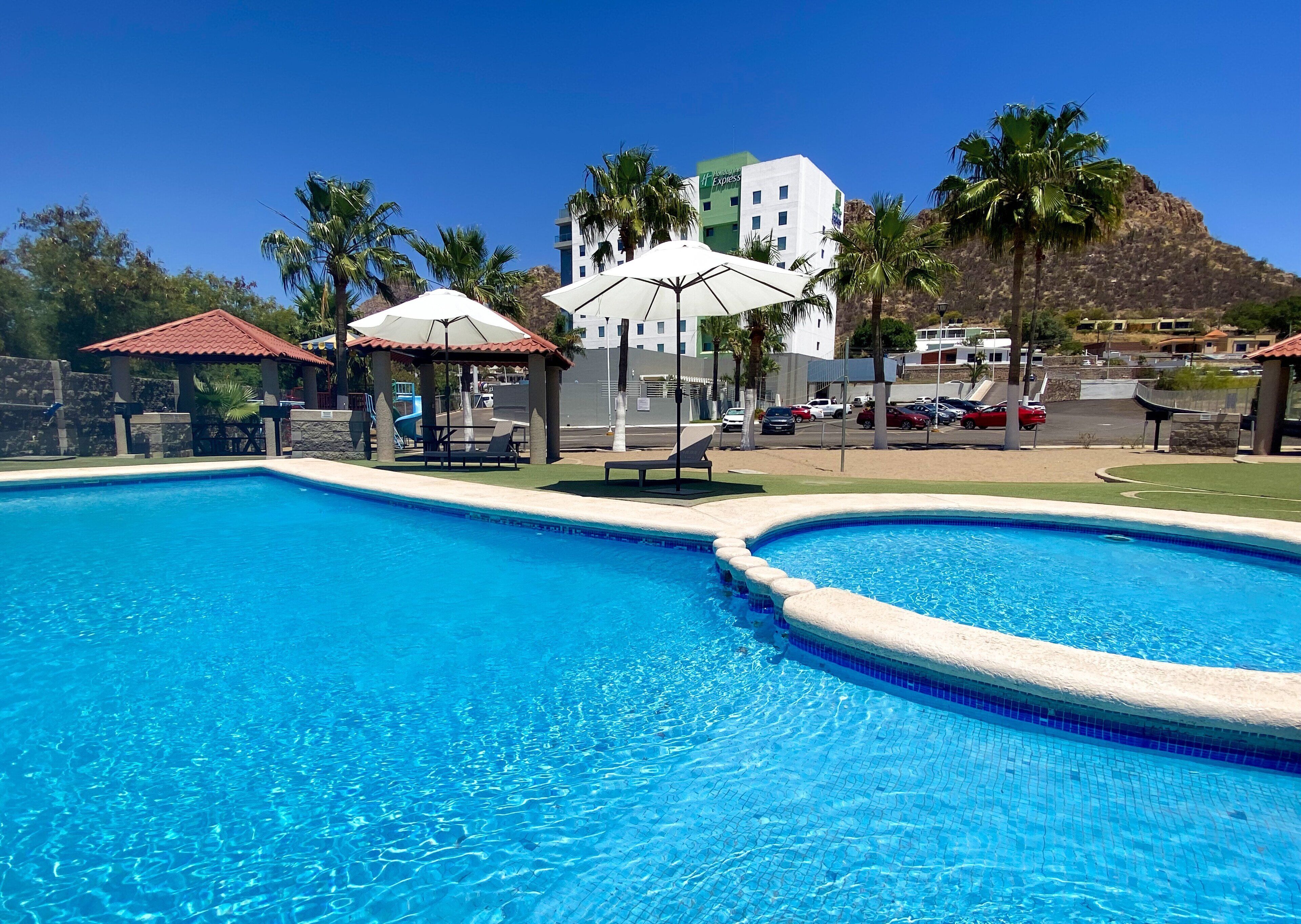 outdoor pool, open 10 am to 10 pm, pool loungers