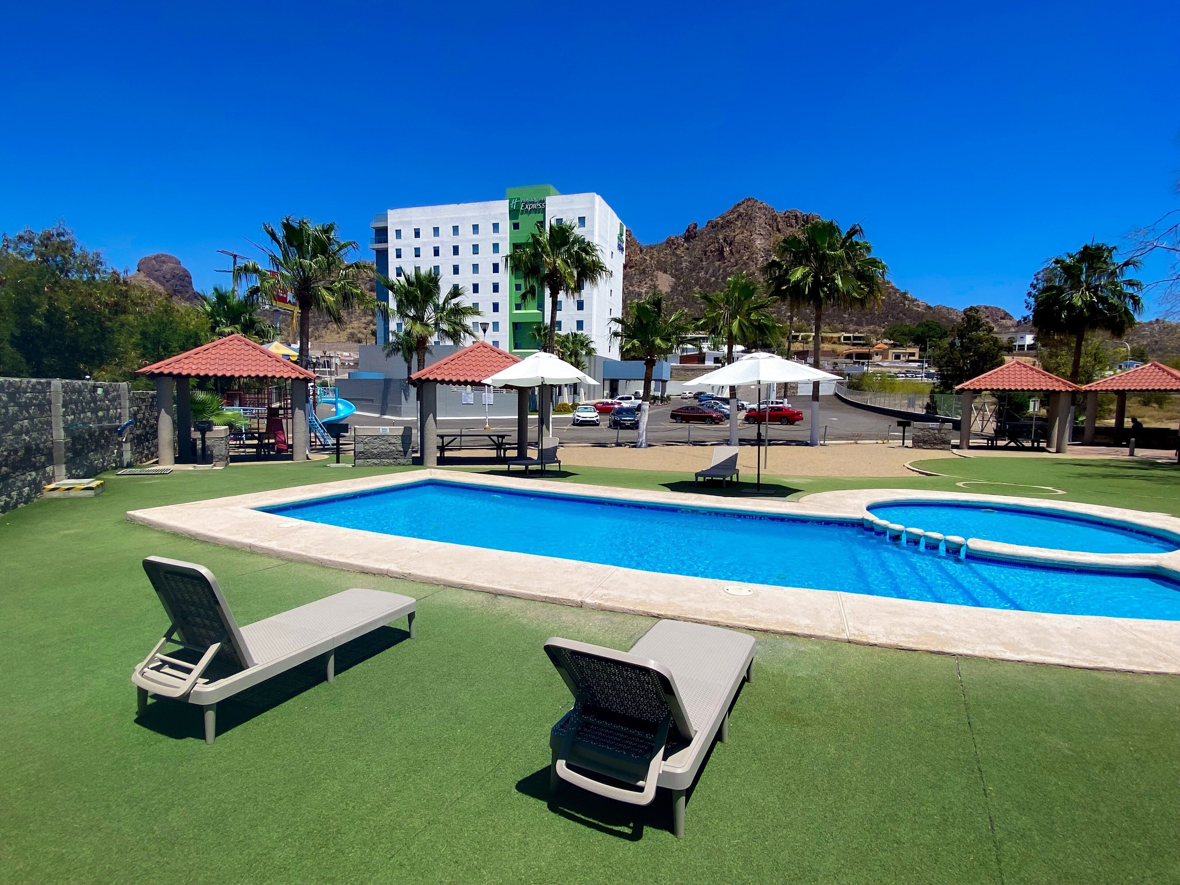 outdoor pool, open 10 am to 10 pm, pool loungers