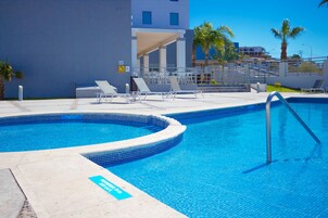 Outdoor pool, open 10 AM to 10 PM, sun loungers