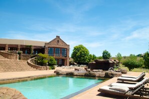 Outdoor pool, open 7:00 AM to 5:00 PM, pool umbrellas, pool loungers
