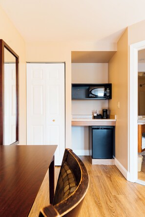 Premium bedding, desk, laptop workspace, blackout drapes