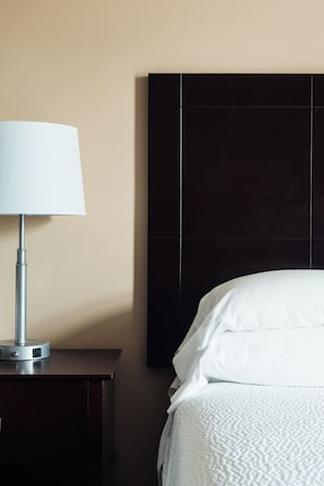 Premium bedding, desk, laptop workspace, blackout curtains
