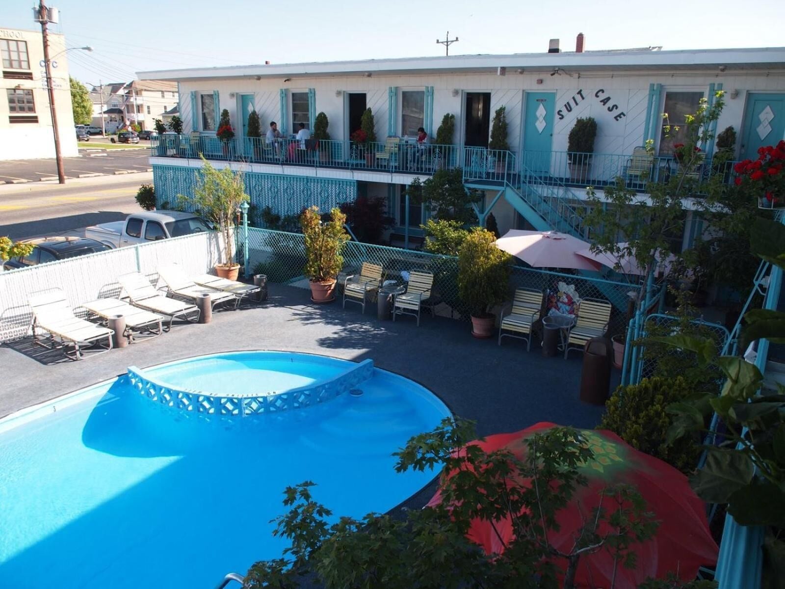 Seasonal outdoor pool, open 10:30 AM to 8 PM, pool umbrellas