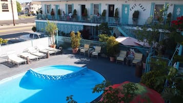 Seasonal outdoor pool, open 10:30 AM to 8 PM, pool umbrellas