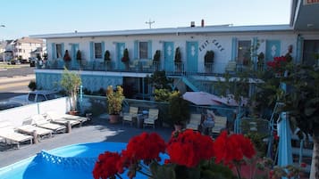 Seasonal outdoor pool, open 10:30 AM to 8 PM, pool umbrellas