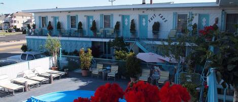 Seasonal outdoor pool, open 10:30 AM to 8 PM, pool umbrellas