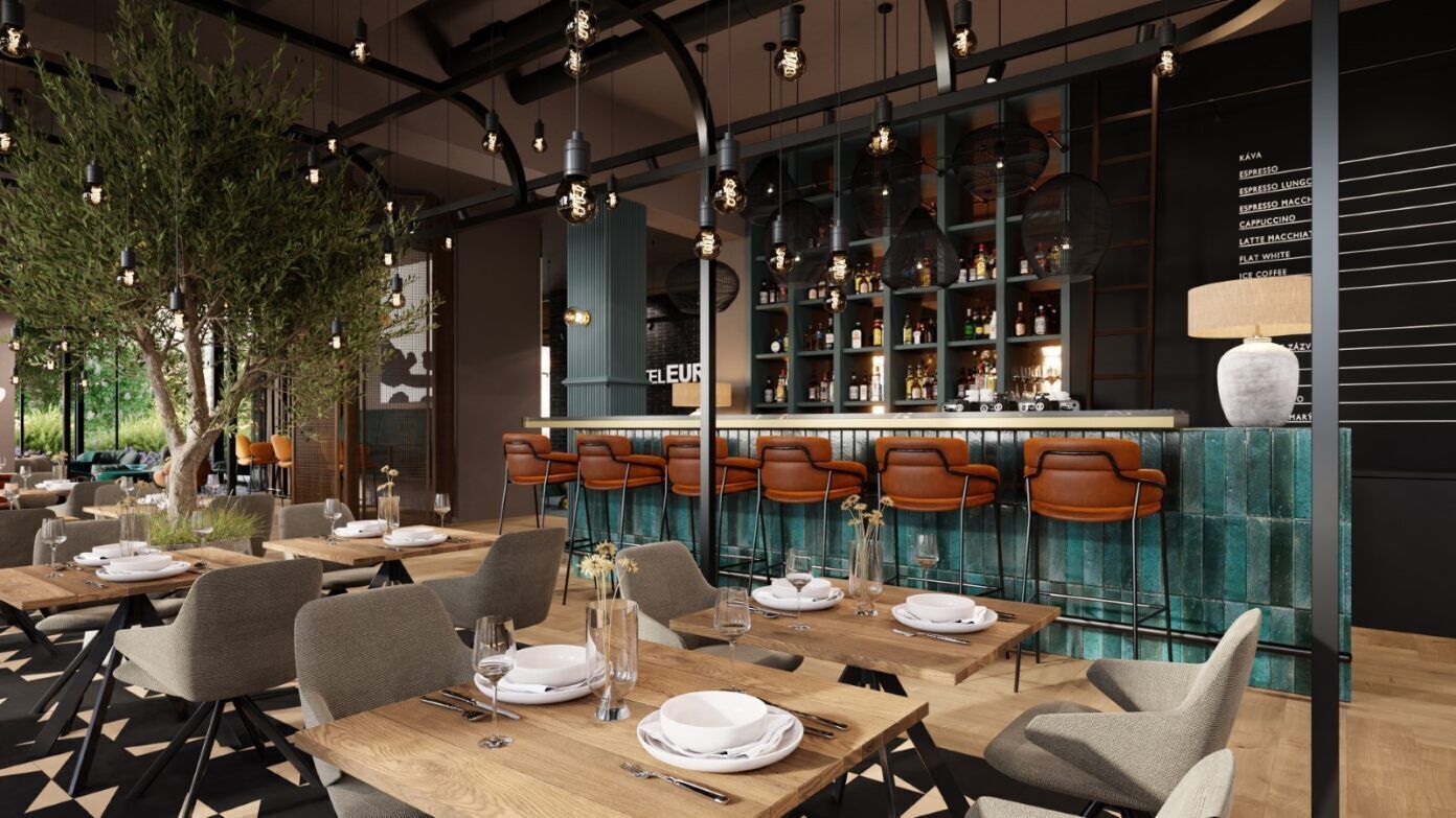 A restaurant with wooden tables and chairs, a bar area with shelves of bottles, and hanging pendant lights.