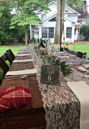 A long wooden table set for a meal with a sign indicating 'Table 6'. - Caldwell House Bed & Breakfast (Salisbury Mills)
