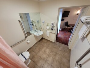Basic Studio, 1 Queen Bed, Ground Floor | Bathroom | Free toiletries, hair dryer, slippers, towels