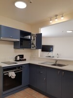 Family Apartment, Multiple Beds | Private kitchen | Fridge, microwave, coffee/tea maker, electric kettle