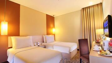 Habitación Deluxe con 2 camas individuales | Ropa de cama de alta calidad y minibar