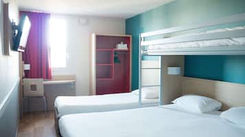 A hotel room with two beds, a desk, a chair, and a wardrobe.