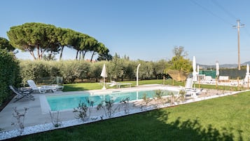 Seasonal outdoor pool, open 9:00 AM to 8:30 PM, pool umbrellas